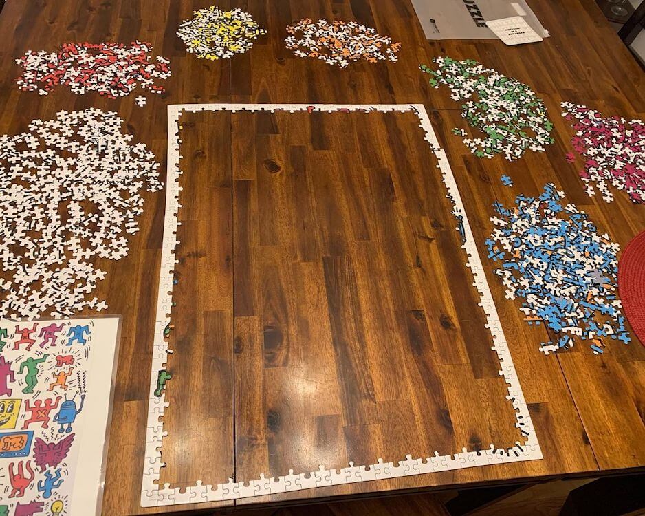 Jigsaw puzzle strategy: Puzzle with the border put together and other pieces sorted by color