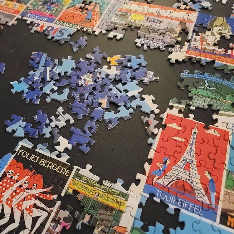 Jigsaw puzzle strategy: partially put together puzzle of different places in Paris