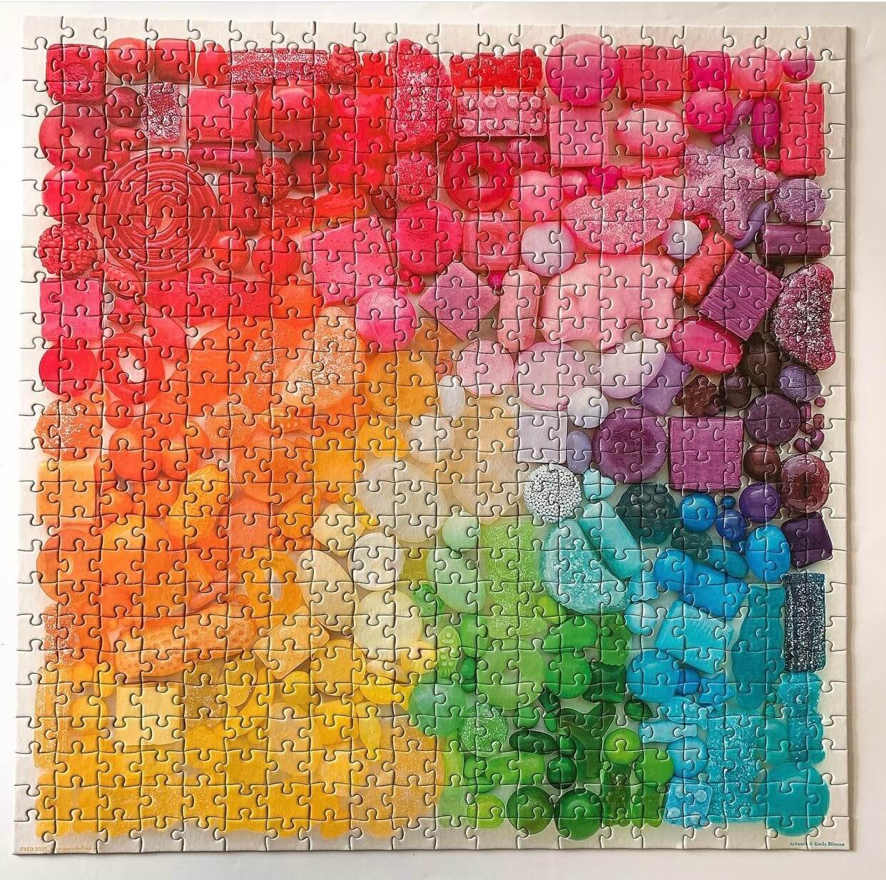A gradient colored puzzle of different candies