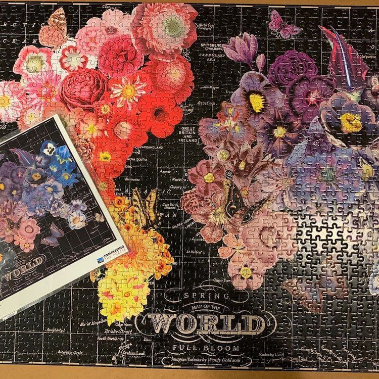 Puzzle with a map of the world with the continents depicted by different colored flower bouquets